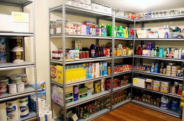 Household pantry shelves stocked with canned food and supplies for a two week outage
